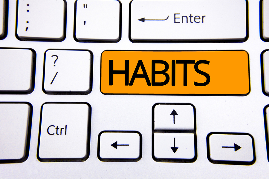 Text sign showing Habits. Conceptual photo Regular tendency or practice Routine Usual Manners Behavior Pattern written Orange Key Button White Keyboard with copy space. Top view.